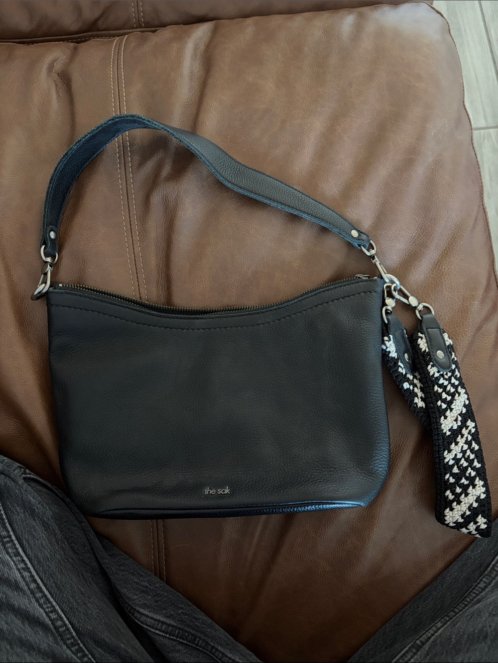 The Sak Black Leather Shoulder Bag with Black & White Woven Strap